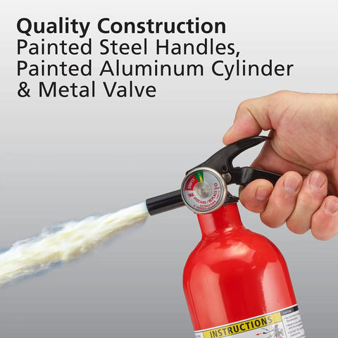 Person using red fire extinguisher with painted steel handles and metal valve, part of Two In One Smoke And Carbon Monoxide Detector With AA Battery Power And LED Warning Indicators Plus Home Fire Extinguisher With Mounting Bracket Included For Easy Safety Upgrades.