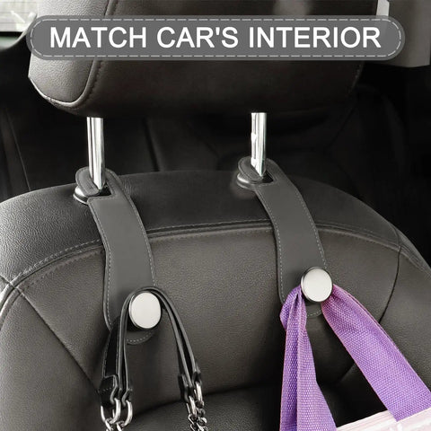 Badass Leather Car Headrest Hooks Two Pack Hella Sturdy Seat Storage Hangers For Bags And Groceries Top Shelf Ride Setup Gray mounted on headrest.