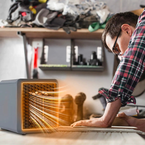 Kick Chilly To The Curb With This Compact Ceramic Space Heater, Plug Straight In At Any Wall Outlet To Blast Serious Turbo Warmth For Cozy Rooms And Offices, Keeps You Snug During Freezing Weather. A man operates a compact ceramic heater.