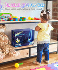 Child beside box of Light Up Kids Pod Swing Chair with LED Lights on toy shelf, featuring colorful play items and a plush tiger.