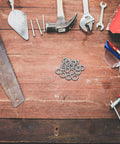 Set Of Twenty M10 Wedge Locking Washers Built Tough With Premium Manganese Steel on a workbench among tools