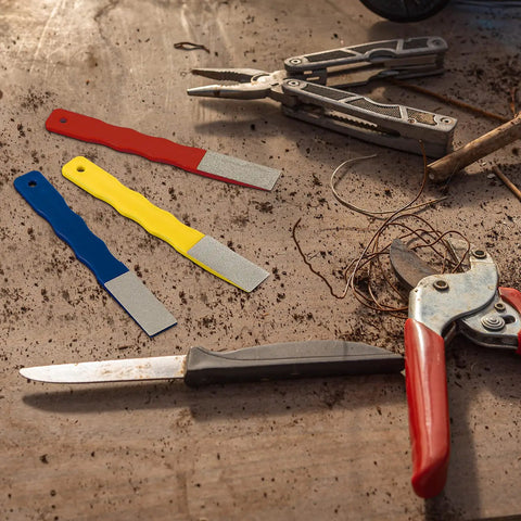 Six Pcs Diamond Sharpening Hones Set With Color Coded Diamond Stones For Hunting And Outdoor Use, shown with tools on table