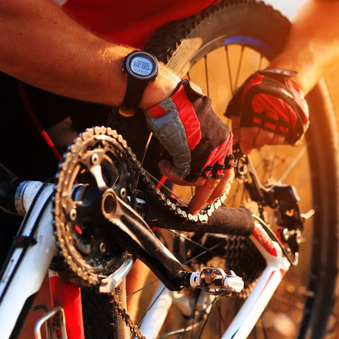 Cyclist installing 8 Pack Bicycle Missing Link Master Links For 6 To 10 Speed Chains on a road bike, wearing red gloves.