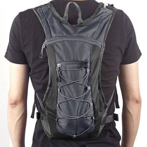 Back view of Hydration Pack Backpack With 70 Oz Water Bladder For Running Hiking Cycling Climbing Camping in Lightweight Gray.