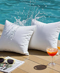 Premium Outdoor Pillow Inserts Pack Of 2 Square 18 By 18 Inches Water Resistant Polyester Throw Pillows by poolside
