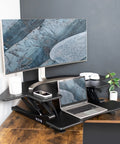 43 Inch Corner Height Adjustable Desk Converter For Sit To Stand Workstation With Dual Monitor Riser, Black Tabletop Stand Up Desk, V Series, set up with laptop and monitor for home office use.