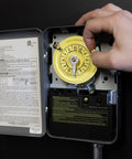 Beefy 24 Hour Mechanical Timer Switch DPST For 208 277 VAC Circuits Indoor Metal Enclosure Manual Override 40 Amp shown in use