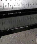 Slotted Tool Board Workstation Accessory Kit For Pegboard Black Secure Hook Engagement Rust Resistant Baked On Finish Durable Accessories Designed For Slotted Tool Boards showing black shelf mounted on pegboard