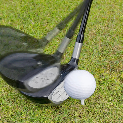 Golf club swinging with 300 Pack Golf Impact Tape For Woods Irons And Putters No Residue Swing Practice Stickers visible on clubface.