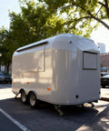Kickstart Your Food Truck Trailer And Hot Dog Cart Venture With Commercial Mobile Kitchen Rig For Coffee Shop And Ice Cream Stand Business Hustle Dope Full Setup, white food trailer with a curved design.