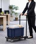 Heavy Duty Folding Hand Truck Workhorse With 330 Lbs Capacity 4 Wheel Dolly Cart For Home Office Shopping And Garage Hauling Compact Foldable Design With Sturdy Black Frame For Easy Storage in office with bin