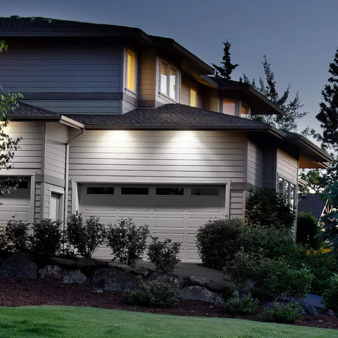 300W Equivalent Mini Corn Cob LED Light Bulb with E26 Base illuminating a home's exterior at night