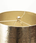 Close-up of metal shade from Industrial Marble and Iron Table Lamp 23 Inch With 3 Way Socket, showcasing brass-toned texture