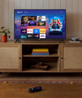 Sleek 32 Inch Full H d Smart Television Packing Hella Crisp Picture Quality And Dead Smooth Streaming Tailored For Chill Bedrooms And Bustling Kitchens on a wooden TV stand with streaming apps displayed.