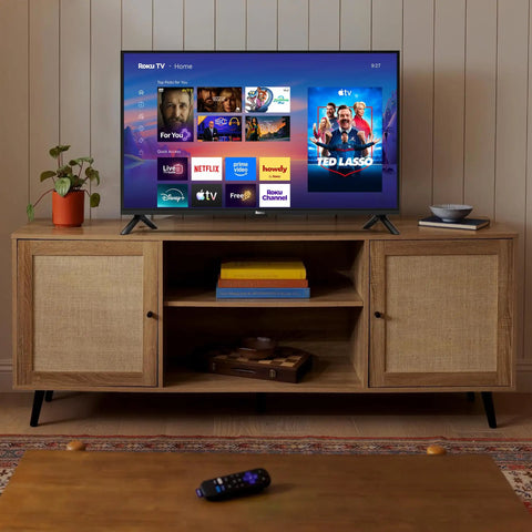 Sleek 32 Inch Full H d Smart Television Packing Hella Crisp Picture Quality And Dead Smooth Streaming Tailored For Chill Bedrooms And Bustling Kitchens on a wooden TV stand with streaming apps displayed.