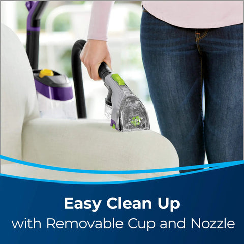 Person using 2-In-1 Pet Upholstery Tool For Carpet And Upholstery Cleaners Tackle Pet Hair, Stains, And Odors on couch
