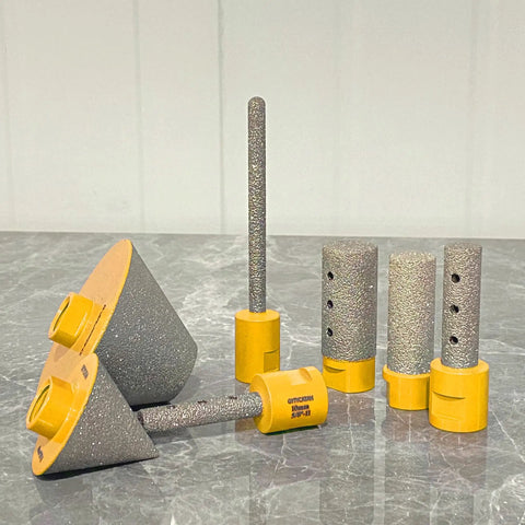 Diamond Beveling Chamfer Bits For Enlarge And Shape Holes In Tile Marble Glass Granite Ceramic Pro Grade Countersink Drill Bits 27mm To 82mm Diameter With 5/8-11 Threads Yellow Finish on a grey surface.