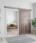 Interior view showing 8 Feet Brushed Nickel Barn Door Hardware Kit for 42 to 48 inch wide panels, installed in a living room doorway.