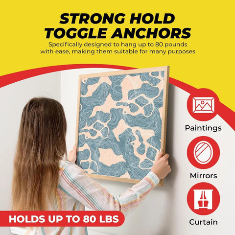 Heavy Duty Drywall Anchors And Screws Kit With Toggle Anchors Self Drilling Zinc Plastic For Secure Hanging Of Pictures And Shelves Includes 25 Pack Durable Corrosion Resistant Fasteners For Quick Install being used to hang artwork