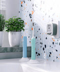Travel Ready European USB Adapter US To Europe Plug 3 In 1 Power Adapter in bathroom with toothbrushes and plants