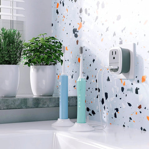Travel Ready European USB Adapter US To Europe Plug 3 In 1 Power Adapter in bathroom with toothbrushes and plants