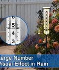 Solar Powered Glass Weather Station Rain Gauge Garden Stake With Freeze Proof Design Fairy Garden Decor Outdoor Yard Crystal Pendant Rain Meter Easy Lawn Rain Reading And Garden Swag in a garden.