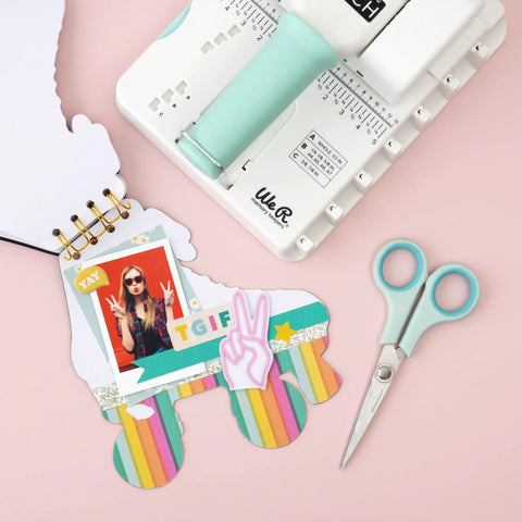 Mini Cinch Binding Tool For DIY Books And Notebooks With Wire Or Spiral Coils Pro Grade Mini Binding Machine on a desk with scissors