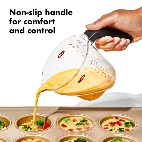 Hand using Angled 3 Piece Measuring Cup Set With Read From Above Design Liquid Measuring Cups For Easy Pouring And Quick Reads Ergonomic Kitchen Essentials For Baking And Cooking No More Bending Or Squinting