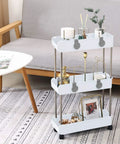 Sleek 3 Tier Slim Rolling Storage Cart With Slide Out Shelves For Tight Squeezes showcasing decorative items in pure white.