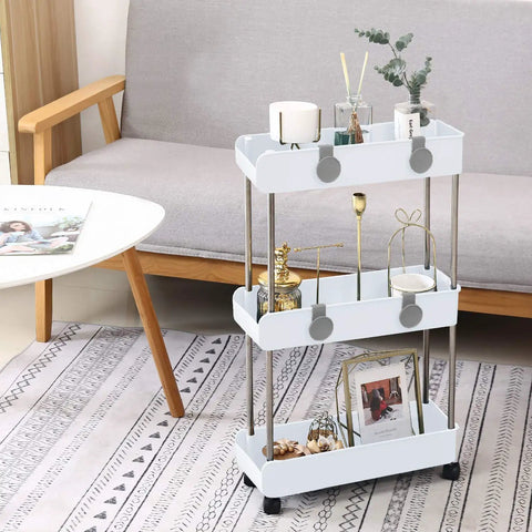 Sleek 3 Tier Slim Rolling Storage Cart With Slide Out Shelves For Tight Squeezes showcasing decorative items in pure white.