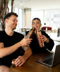 Two people toasting with Copper Water Bottle 1 Liter With Ayurvedic Health Benefits, Leakproof Copper Vessel For Drinking Water