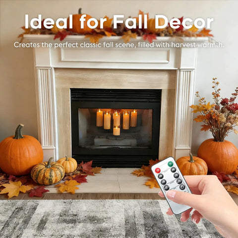 Amber LED Flameless Pillar Candles With Remote Timer 5 Pack in fireplace with pumpkins and fall decor