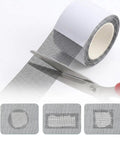 Heavy Duty Window Screen Repair Tape Two Inch By Sixteen Foot Black Fiberglass Mesh Patch Kit shown with scissors cutting tape.