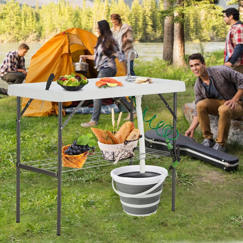 Folding Fish Cleaning Table With Collapsible Bucket And Faucet For Outdoor Camping Fillet Station Portable Sink Table in use at campsite