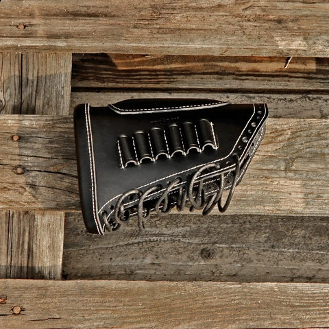 Leather Recoil Pad With Shell Holder For Rifle Buttstock Cheek Riser, Lace On, Black, Holds Up To Six Shells, on wood background