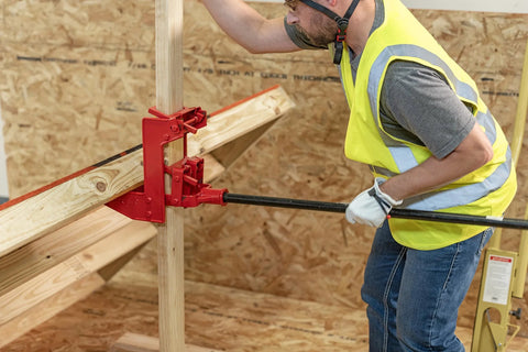 Guardian 2601 portable wall jack, side view, red cast-iron, 1000 lb capacity for wood poles or steel pipe