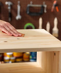 Hand smoothing wood surface in workshop using Stainable Wood Filler For Cracks And Dings 16 Oz Paintable Latex Formula That Accepts Oil And Water Based Stains Indoor Outdoor Repair Solution Great For Fixing Cracks Gaps And Nail Holes In Woodwork Cabinets And Furniture