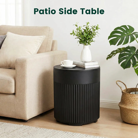 Black round table beside beige sofa with houseplant, labeled 'Patio Side Table', showing indoor use for Tough As Nails 90lb Water Filled Patio Umbrella Base With Built In Ice Cooler 3 In 1 Outdoor Table With Umbrella Hole Fits 1.5 To 1.9 Inch Poles For Poolside Deck And Garden Black.