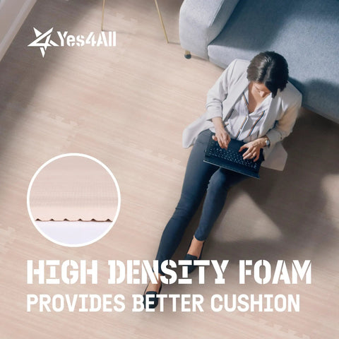 Person sitting on Interlocking EVA Floor Mats Puzzle Tiles with border, showing high density foam for home or garage use.