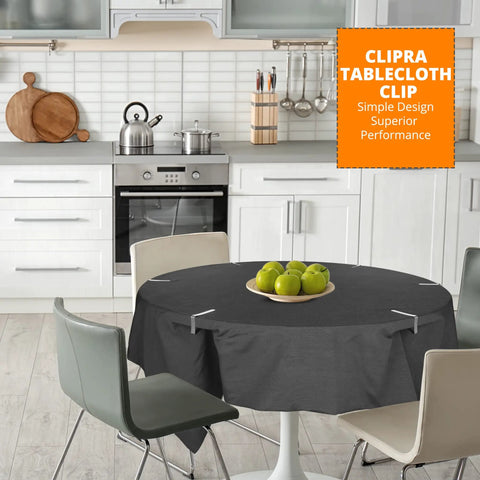 Dining table with black tablecloth secured by stainless steel tablecloth clips suited for tables up to 1.8 inches thick.
