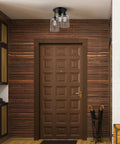 Three Light Bronze Semi Flush Mount Ceiling Light With Seeded Glass Shades in rustic entryway decor setting