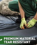 Worker installing Tough As Nails Weed Barrier Landscape Fabric 3ft By 30ft, Commercial Grade Non Woven Ground Cover
