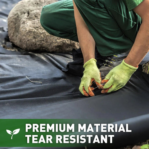 Worker installing Tough As Nails Weed Barrier Landscape Fabric 3ft By 30ft, Commercial Grade Non Woven Ground Cover