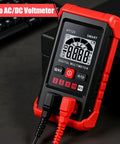 Digital Multimeter With Auto Ranging And NCV Non Contact Voltage Tester on a desk showing display and connections