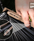 Auto Feed Hog Ring Plier 16-Gauge With Spring Loaded Magazine used in one-handed operation on black material
