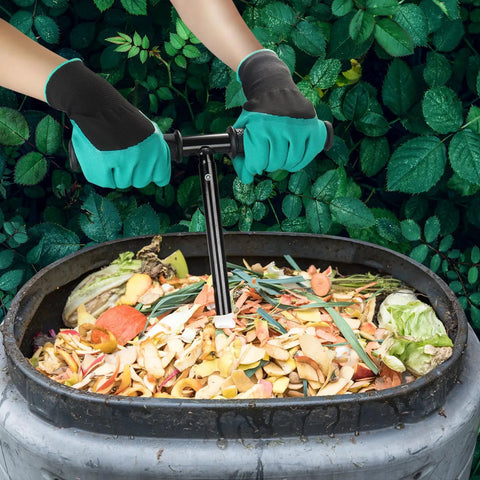 Hands using Built Tough Aerator Tool With Rotating Spiral For Outdoor Tumbler Bins And Bags Tall 33 Inch Stand Up Turner on compost pile