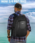 Person wearing Waterproof Hard Case For DJI Mini 4 Pro And Mini 3 Pro, Rugged Drone Travel Backpack outdoors by sea
