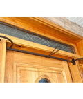 No Sweat Setup Front Door Garland Hanger With Thick Rubber Padded Ends For Year Round Decor Fits Wide Doorjambs No Drill Needed Holds Twenty Pounds Like A Champ Straight Up Heavy Duty Steel mounted above a wooden door.