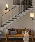 Plug In Wall Light Set Of 2 With Swing Arm Design, Linen Lampshades, Modern Bedroom Wall Sconces For Reading, Hallway And Living Room, 270 Degree Adjustable Head, Easy Install, Cozy Accent Lighting illuminating a staircase and seating area.
