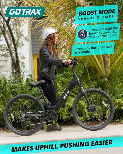 Rider with helmet on black 26 Inch Electric Bike With 350W Brushless Motor Up To 20 MPH, 30 Mile Pedal Assist Range, Front Shock, 7-Speed